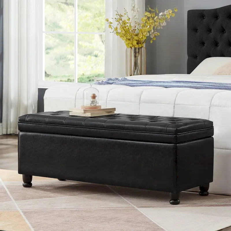 Banc de rangement capitonné noir avec revêtement en similicuir et pieds en bois tournés, Banc Ottoman de rangement